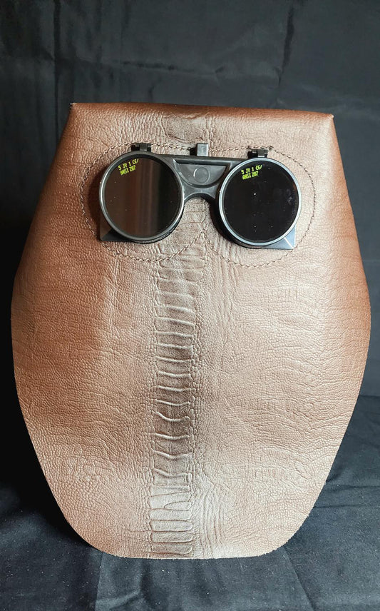 EMBOSSED BROWN OSTRICH LEG LEATHER.